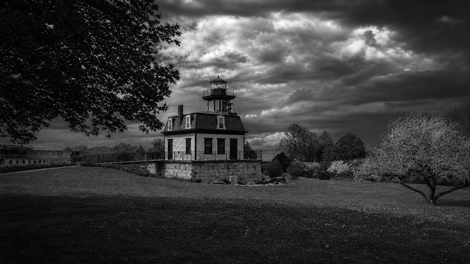 Monochrome editorial rendering of the lighthouse exhibit at Shelburne Museum.