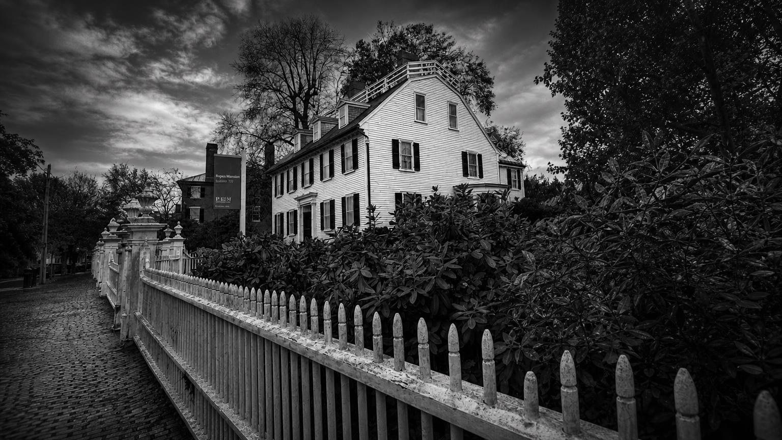 Monochrome editorial rendering of Ropes Mansion behind its picket fence.