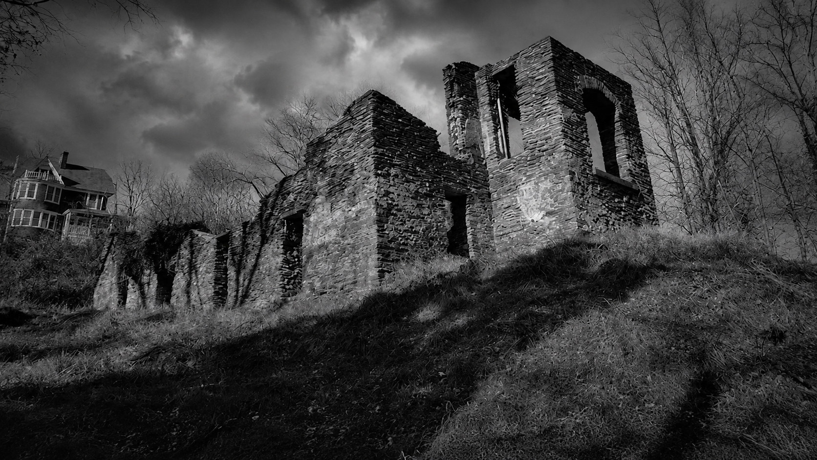 Monochrome editorial rendering of the Harpers Ferry church ruins and stone walls.