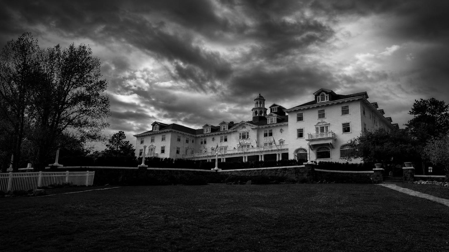 Monochrome editorial rendering of the Stanley Hotel and its mountain setting.