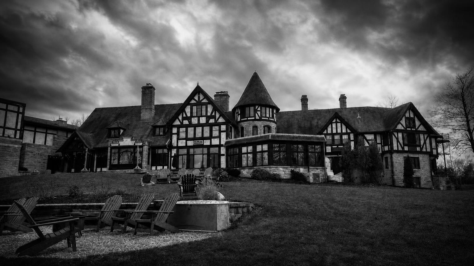 Monochrome editorial rendering of Punderson Manor's roofline and lakeside building.